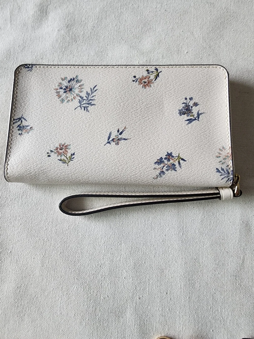 Coach Cream Dandelion Floral Zip Wristlet with Blue and Pink Accents